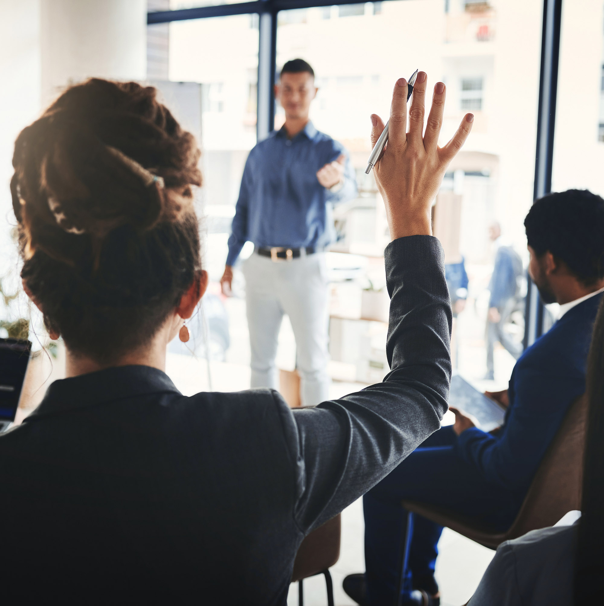 Businessman, Coaching And Presentation With Audience In Faq, Answer Or Leadership At Office Workshop. Male Leader Speaking In Staff Training With Hand Raised For Marketing, Planning Or Strategy Idea