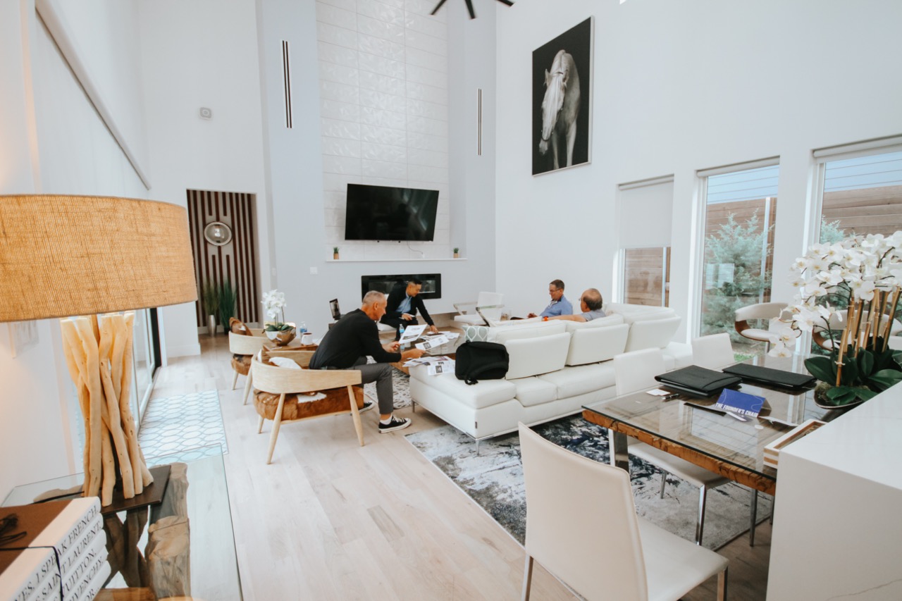 Large living room with white walls and furniture