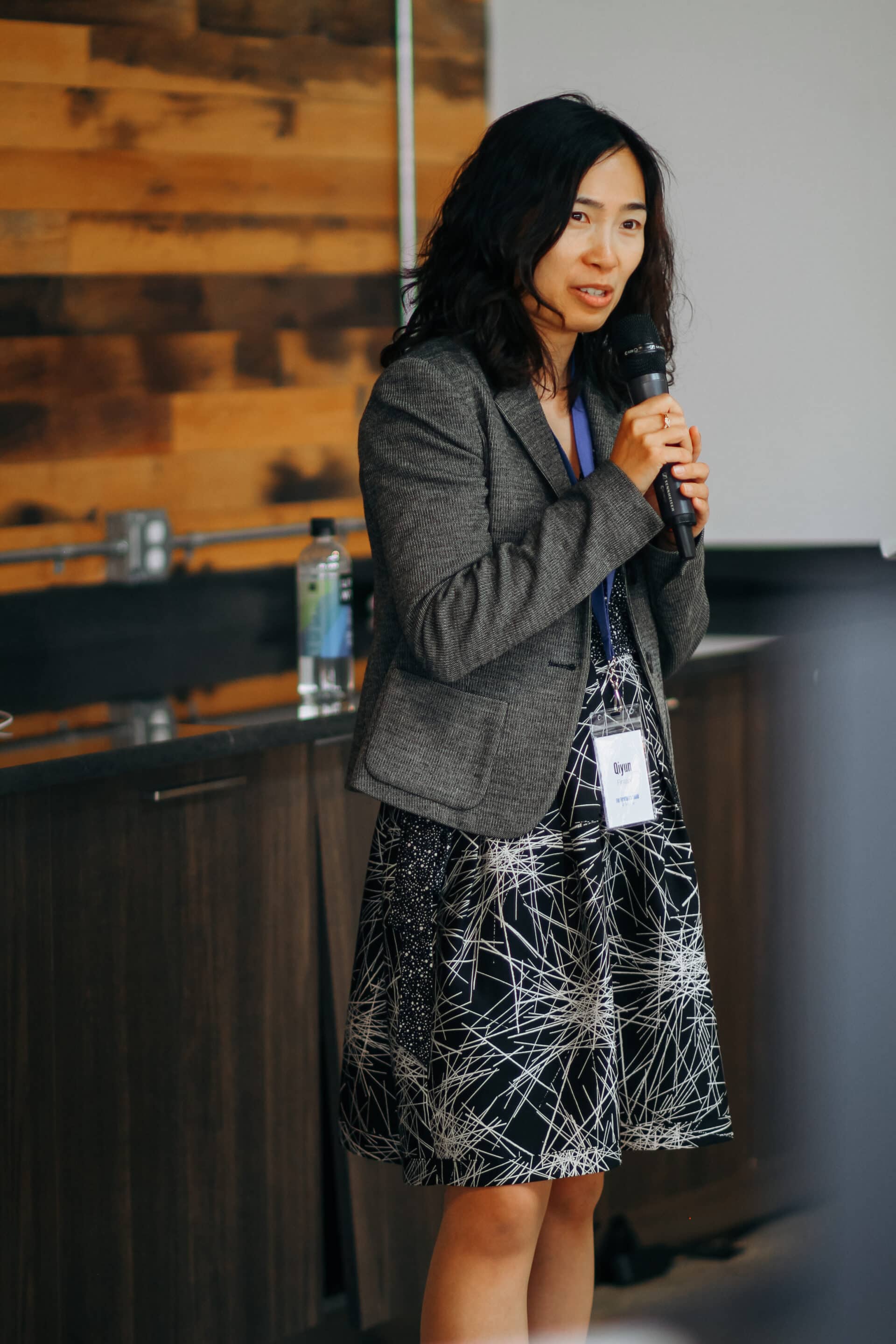 Woman presenting at TFC Detroit, raising capital and looking for strategic advisory
